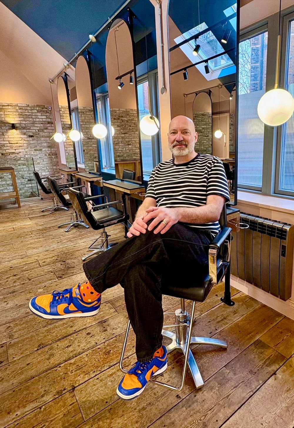Bernd Rossmanith-Shoulder relaxed in the chair at Arnold Circus, East London